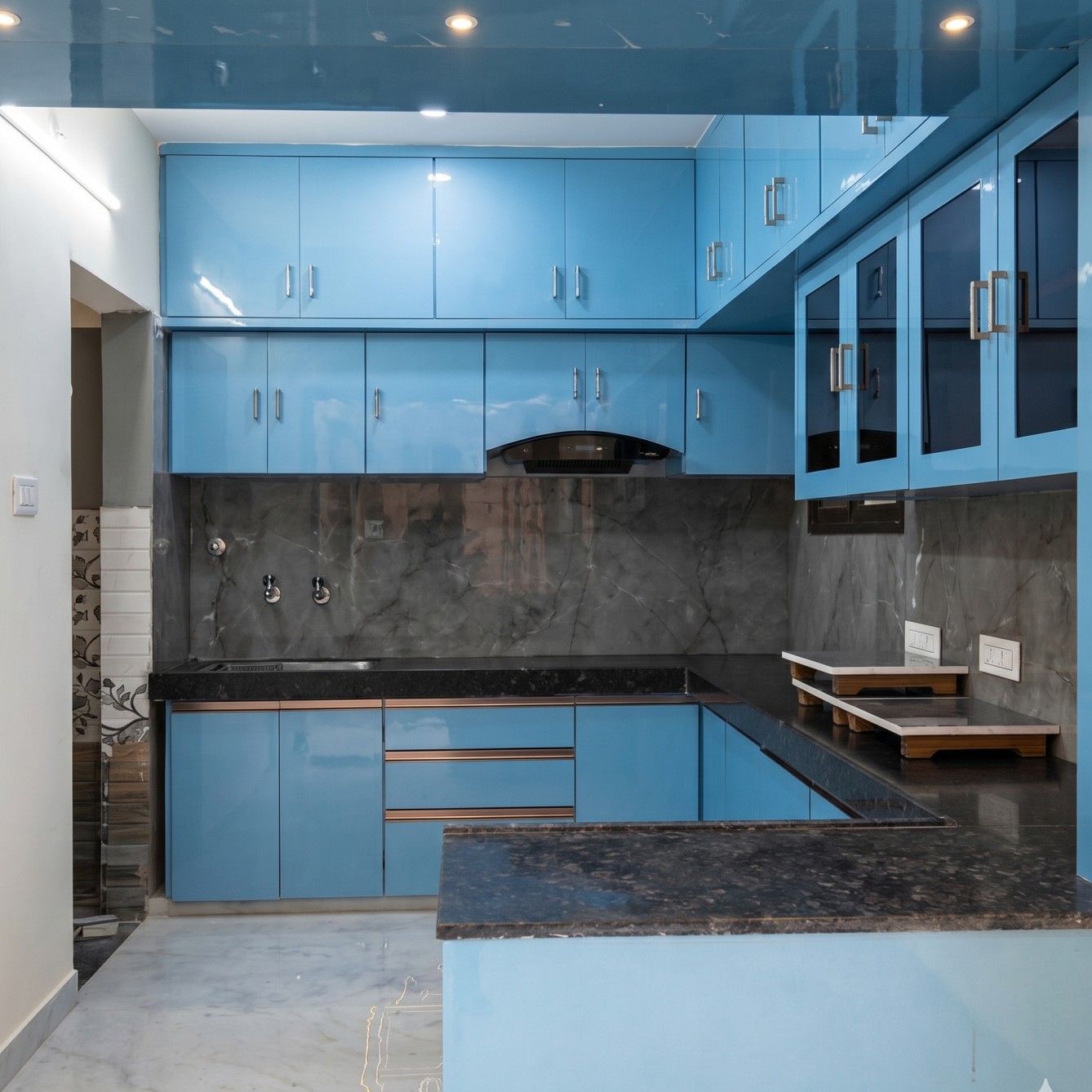 Blue Kitchen with black countertop