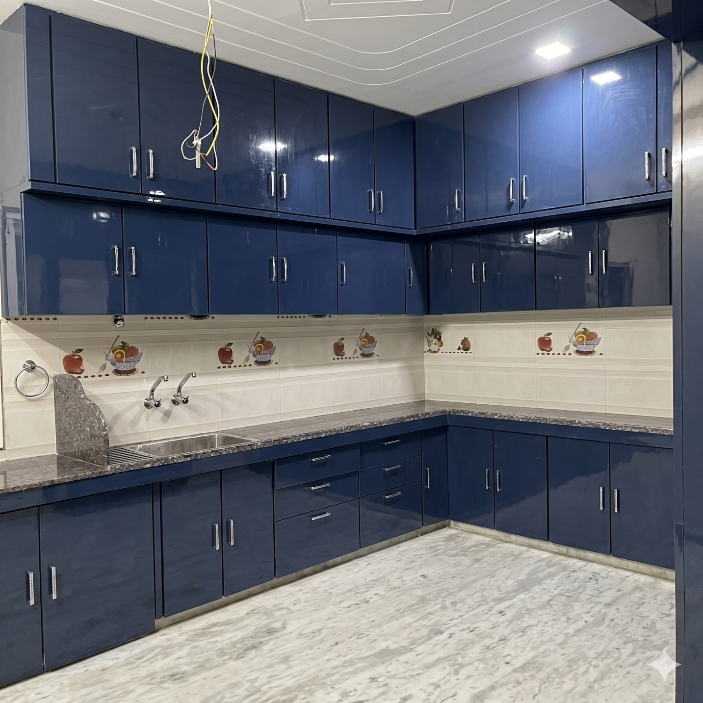 Glossy look kitchen with navy blue and black countertop